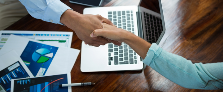 CRM for professional services shaking hands at meeting